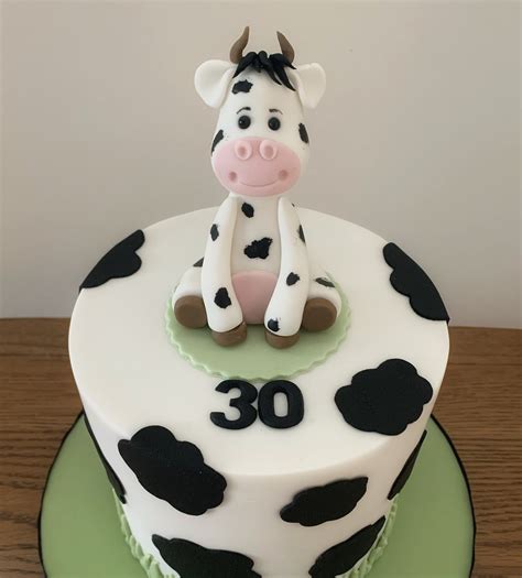 Cowgirl 1st Birthday. . Cow cake topper